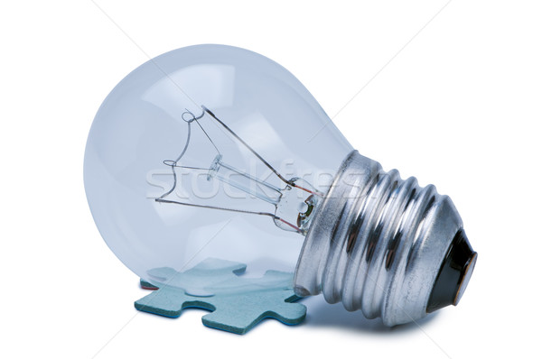 Bulb and puzzle isolate on white background. Stock photo © borysshevchuk