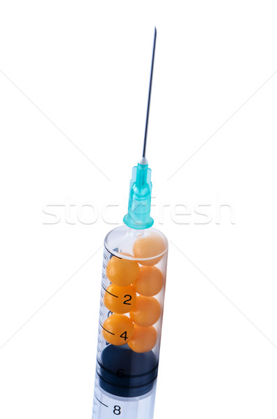 Syringe with pills isolate on white background. Stock photo © borysshevchuk