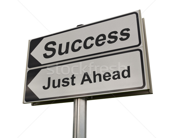 Success just ahead road sign isolated on white background. Stock photo © borysshevchuk