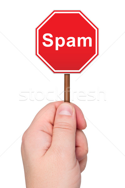 Spam road sign in hand isolated on white background. Stock photo © borysshevchuk