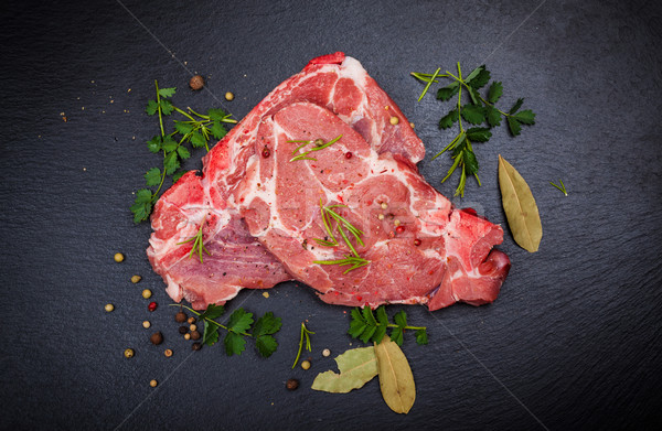 Fresh raw meat on black board Stock photo © brebca