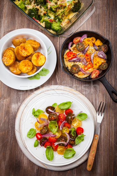 Tomato salad with grilled cheese and baked potatoes Stock photo © brebca