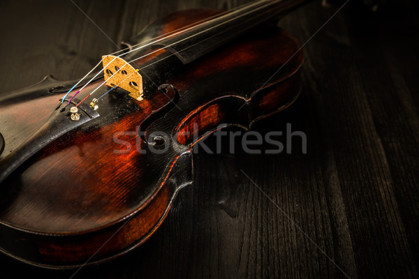 Old violin in vintage style on wood background Stock photo © brebca