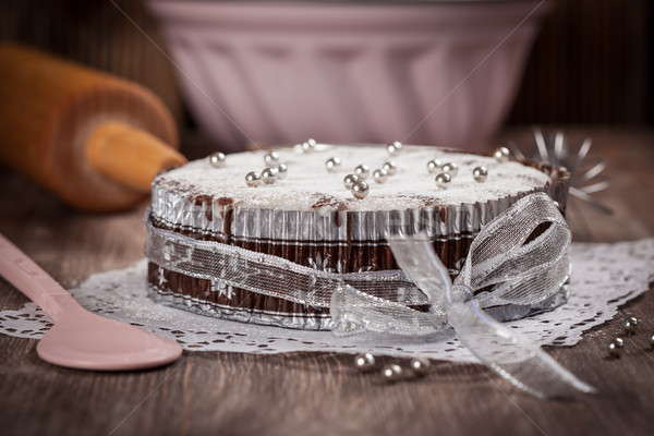 White and chocolate Christmas cake with baking utensils Stock photo © brebca
