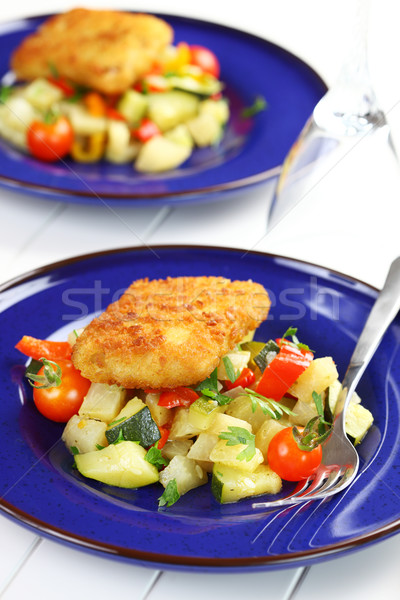 Fried fish fillet on vegetables Stock photo © brebca