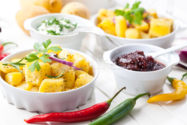 Baked potatoes with chutney and sour cream Stock photo © brebca
