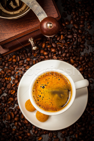 Espresso cup in coffee beans Stock photo © brebca