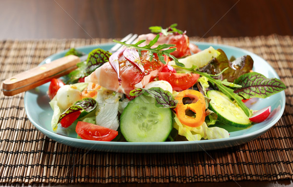 Stock photo: Vegetable salad with Prosciutto cheese rolls