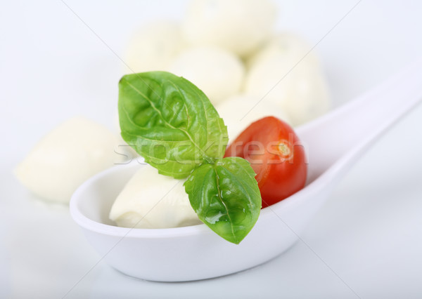 Mozzarella with tomato and basil Stock photo © brebca