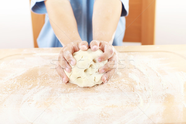 Child kneading dough Stock photo © brebca