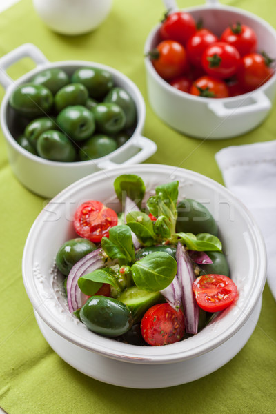 Delicious Greek salad with green olives Stock photo © brebca