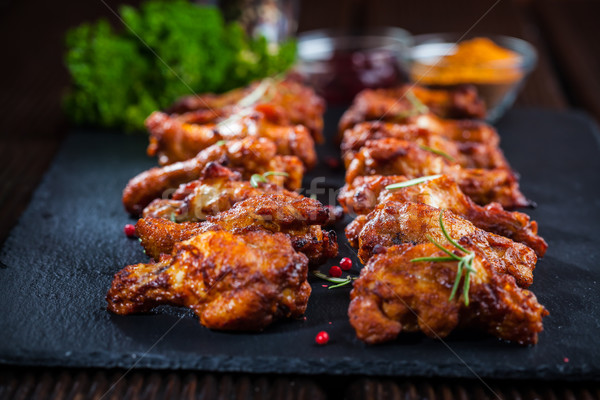 Chicken wings with spices and herbs Stock photo © brebca