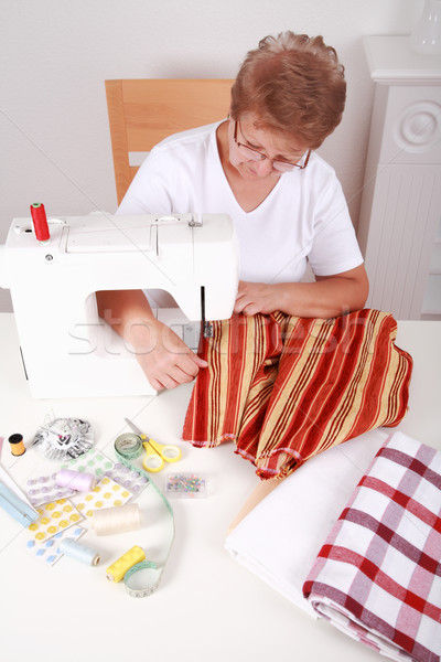 Elderly woman sewing Stock photo © brebca