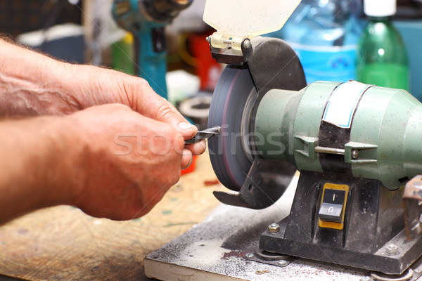 Man working with sharpening machine tool Stock photo © brebca