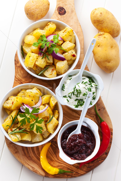 Baked potatoes with chutney and sour cream Stock photo © brebca