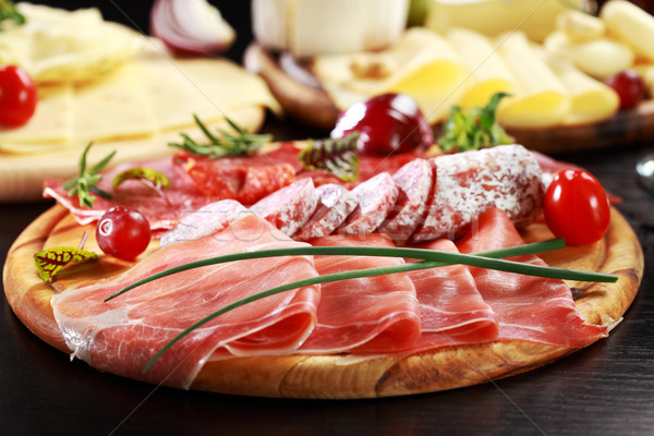 Stock photo: Salami and cheese platter with herbs