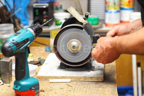 Man working with sharpening machine tool Stock photo © brebca