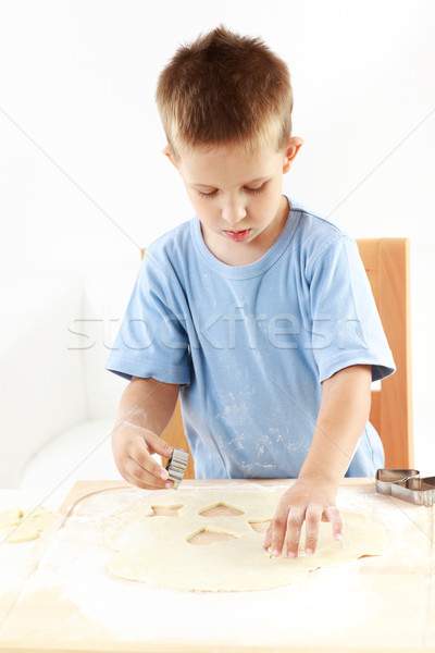 Small boy cutting cookies Stock photo © brebca