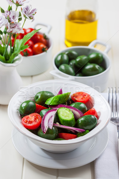 Greek salad with green olives Stock photo © brebca