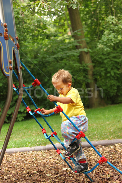 Stock photo: Kid at playground 