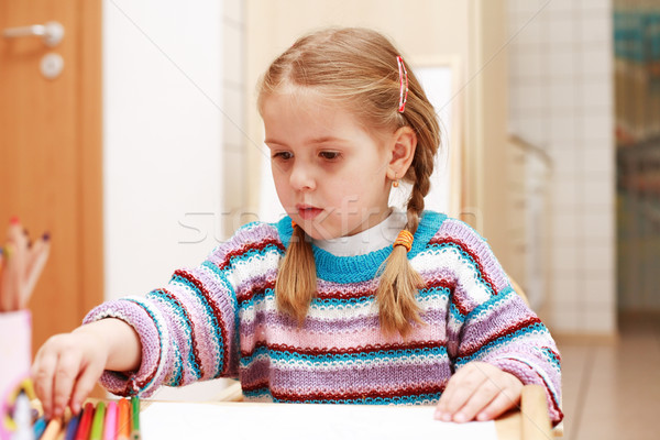Stock photo: Cute little girl painting