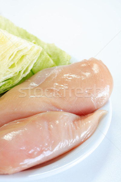 Raw chicken breast with iceberg lettuce Stock photo © brebca