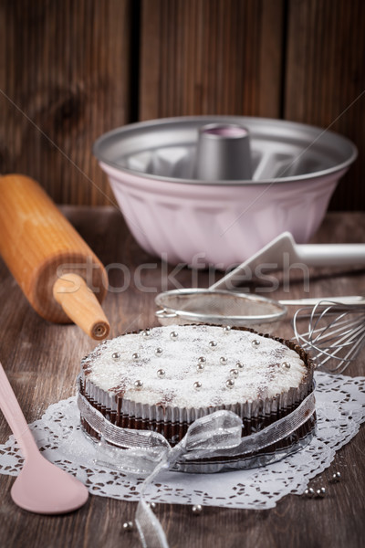 Christmas cake with baking utensils Stock photo © brebca