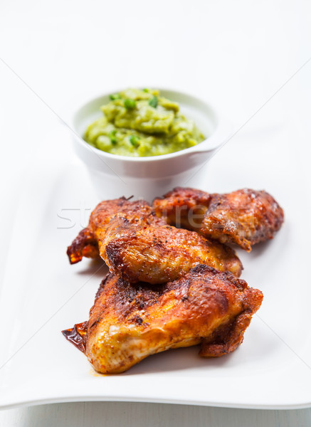 Grilled chicken wings with guacamole Stock photo © brebca