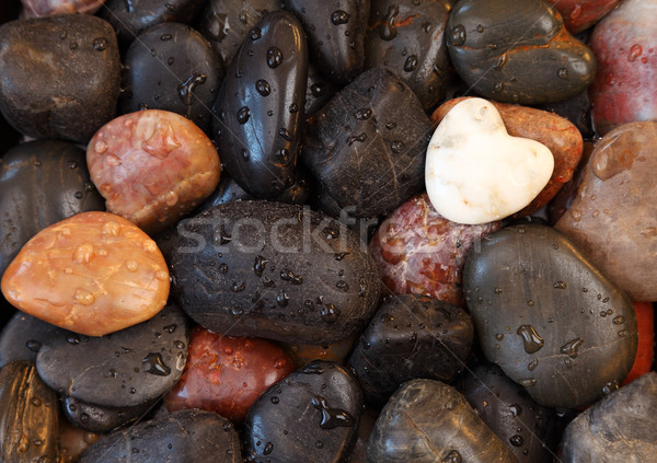 White stone heart surrounded by other stones Stock photo © brebca