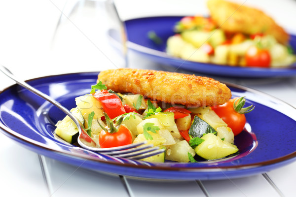 Fried fish on vegetables Stock photo © brebca