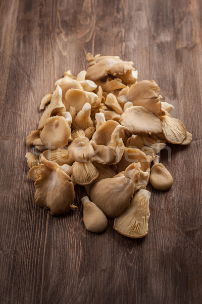 Fresh organic oyster mushrooms on a wooden table Stock photo © brebca