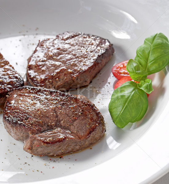 Steak három darabok fehér tányér étel Stock fotó © brebca