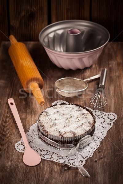 White and chocolate Christmas cake with baking utensils Stock photo © brebca