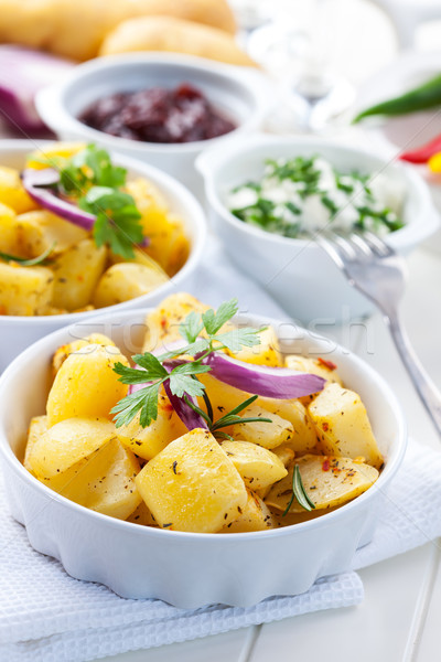 Baked potatoes with chutney and sour cream Stock photo © brebca