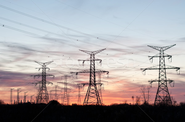 Elektrik towers elektrik gün batımı uzun hat Stok fotoğraf © brianguest