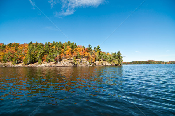 Stock photo: Canadian Lake with Autumn Colours and Blue Sky