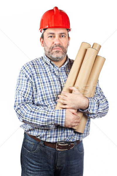 Stock photo: Construction worker holding cardboard tubes
