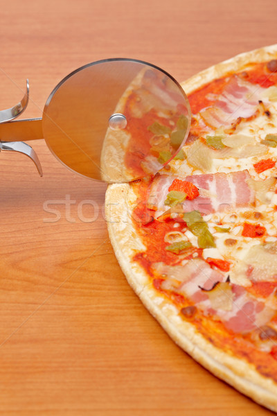 Italian pizza and cutter Stock photo © broker
