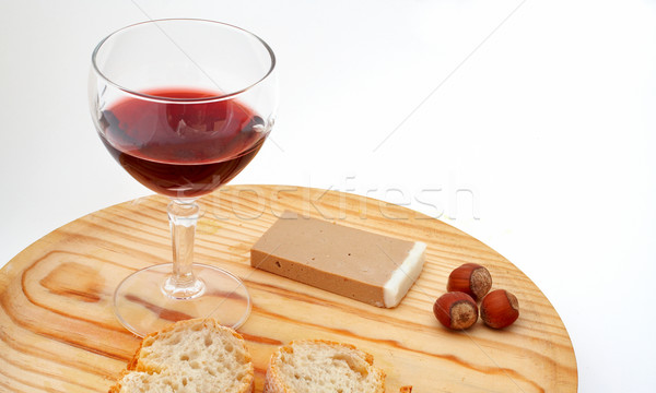 Pate, bread, glass of red wine, hazelnuts on wood plate Stock photo © broker