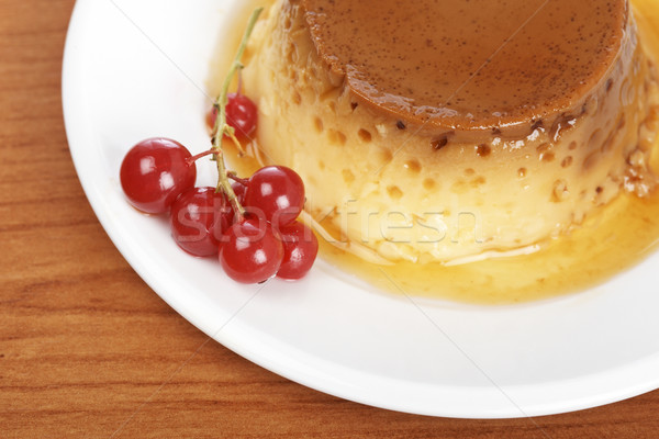 Cream caramel dessert with red currants Stock photo © broker