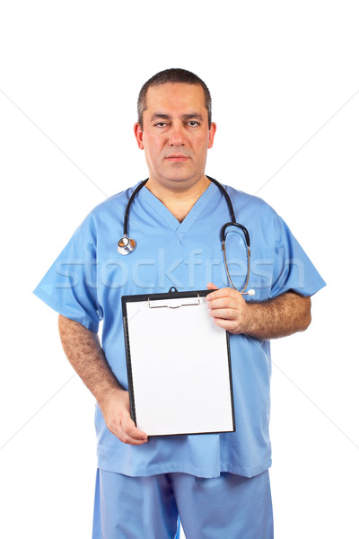 Male doctor showing a blank clipboard Stock photo © broker