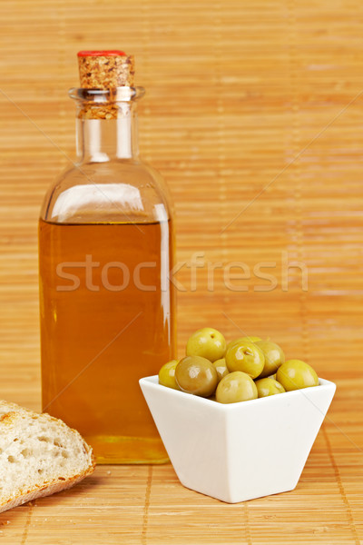 Bread, olive oil bottle and olives Stock photo © broker