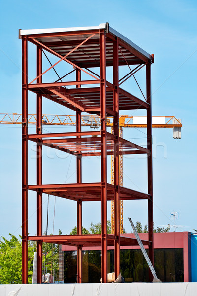 Steel Structure and Construction crane set against a blue sky Stock photo © broker