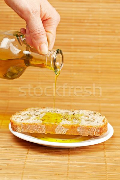 Pouring olive oil Stock photo © broker