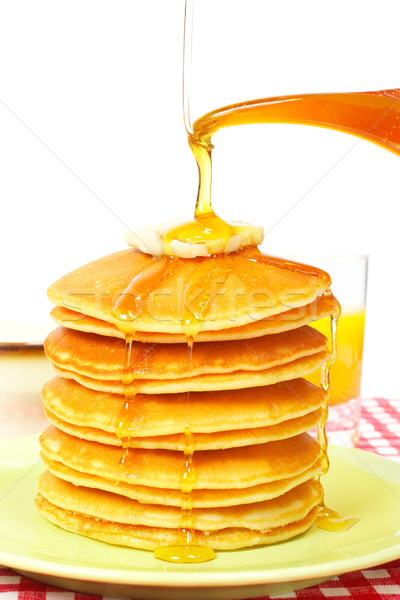 Pouring syrup on the pancakes Stock photo © broker