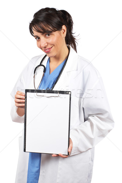 Female doctor showing a blank clipboard Stock photo © broker