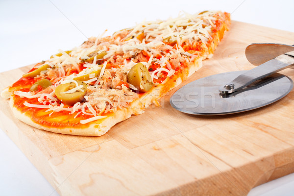 Detail of slices Italian pizza and cutter Stock photo © broker