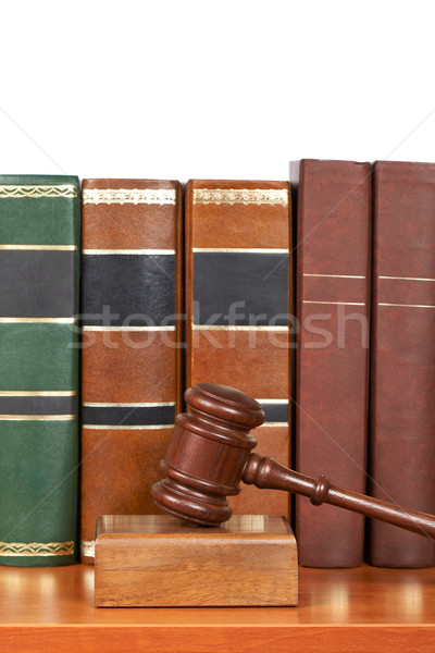 Wooden gavel and old law books Stock photo © broker