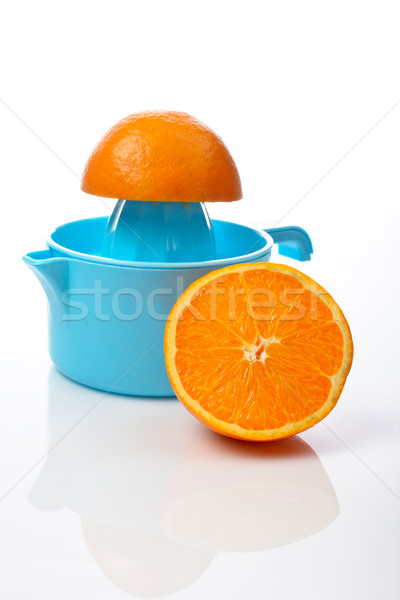 Squeezer and two half orange Stock photo © broker