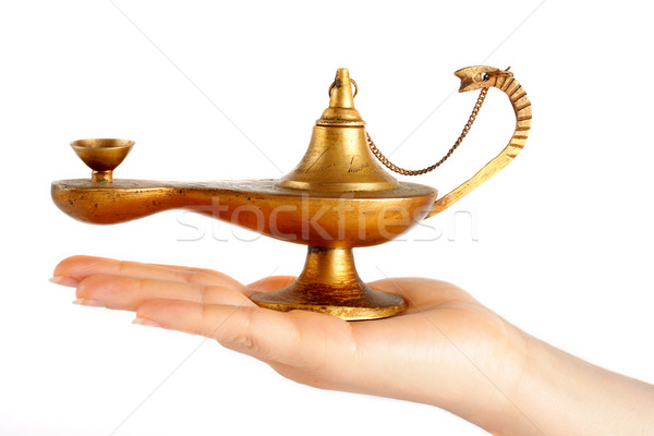 Old brass oil lamp on the hand Stock photo © broker